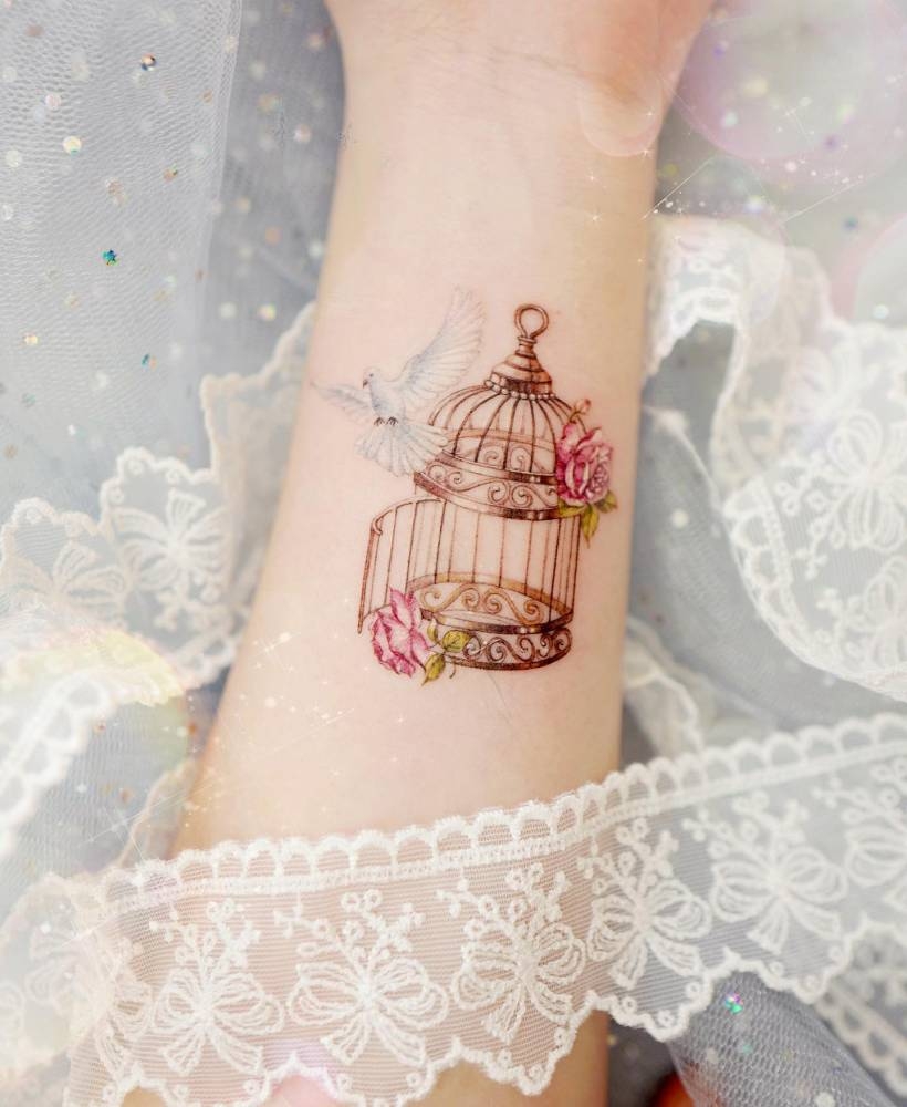 Dove And Bird Cage Tattoo Located On The Wrist Dove And Bird Cage Tattoo Located On The Wrist