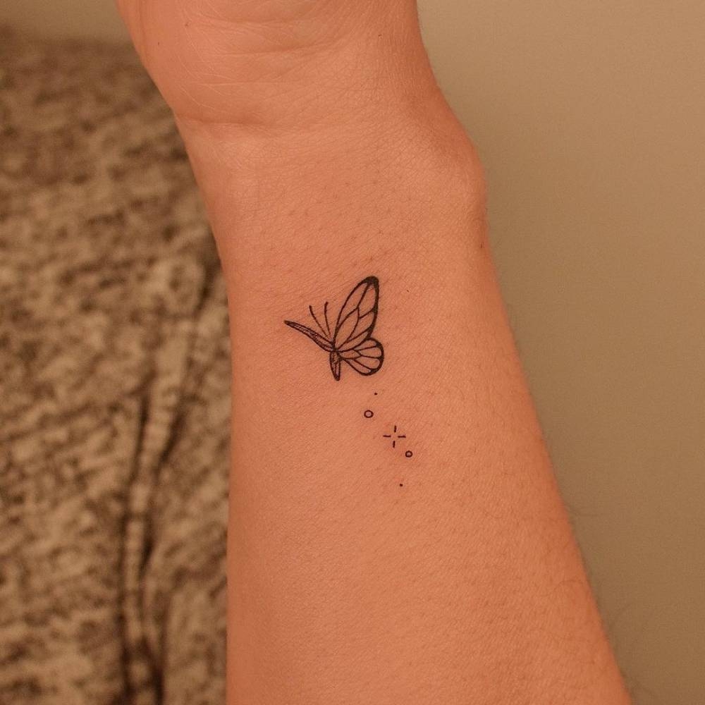 Minimalist Butterfly Tattoo On The Wrist Minimalist Butterfly Tattoo On The Wrist